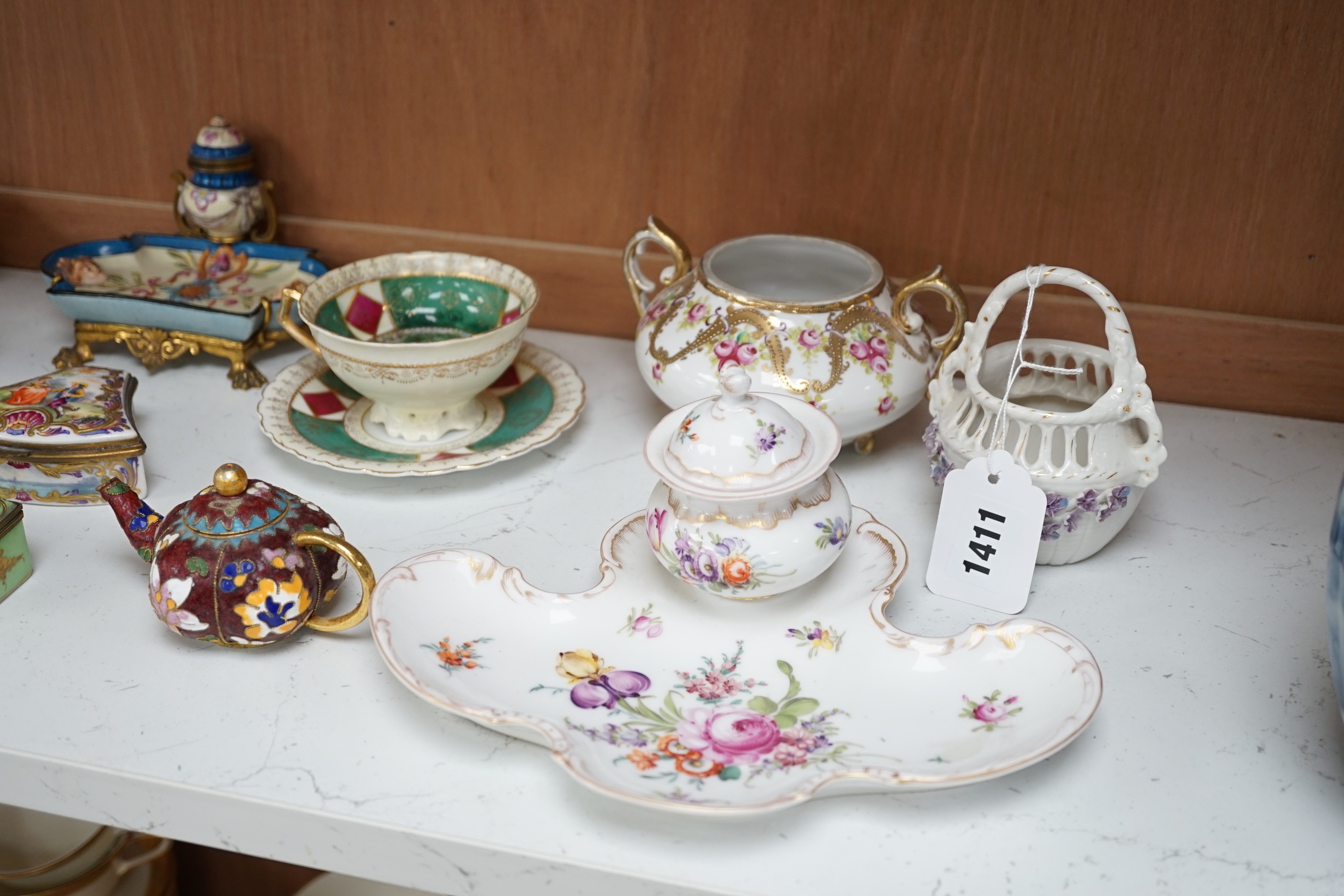 A large group of continental ceramics to include mainly 19th century including one piece of Zsolnay, Dresden wares, trinket boxes, a pottery and gilt metal mounted inkstand etc